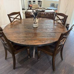 solid-wood dining table with four matching chairs and sideboard buffet
