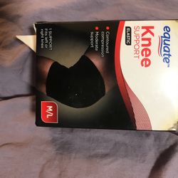 Knee support black fits left and right knee size medium to large