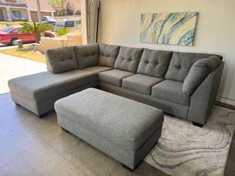 Gray 2 pc sectional couch with storage ottoman ( Delivery Available )