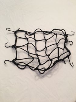 Motorcycle bungee netting luggage holder.
