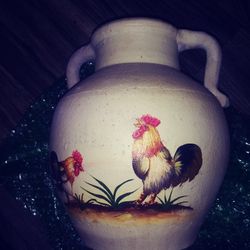 Vintage pottery jug with Roosters on it.