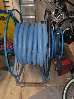 Vacuum and water hoses with reel