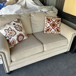 Loveseat with pillows
