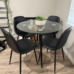 wayfair glass dining table and amazon leather black chairs