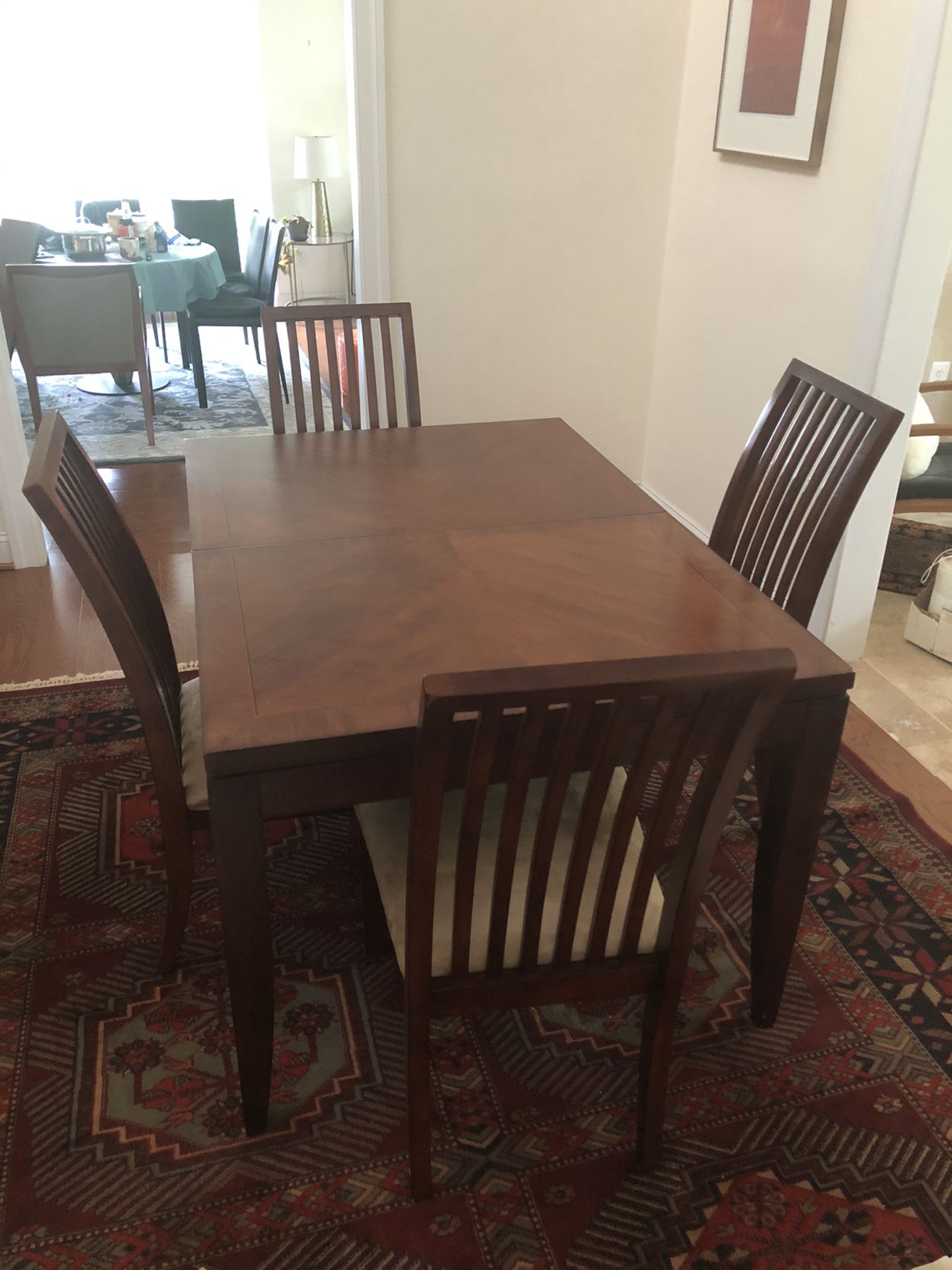 Dining table with extension and four chairs. 66” with a 12” extension. $150