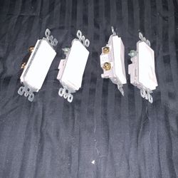 Four  modern flat tail light switches single pole