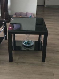 Three black/silver glass tables. One coffe table two end tables.