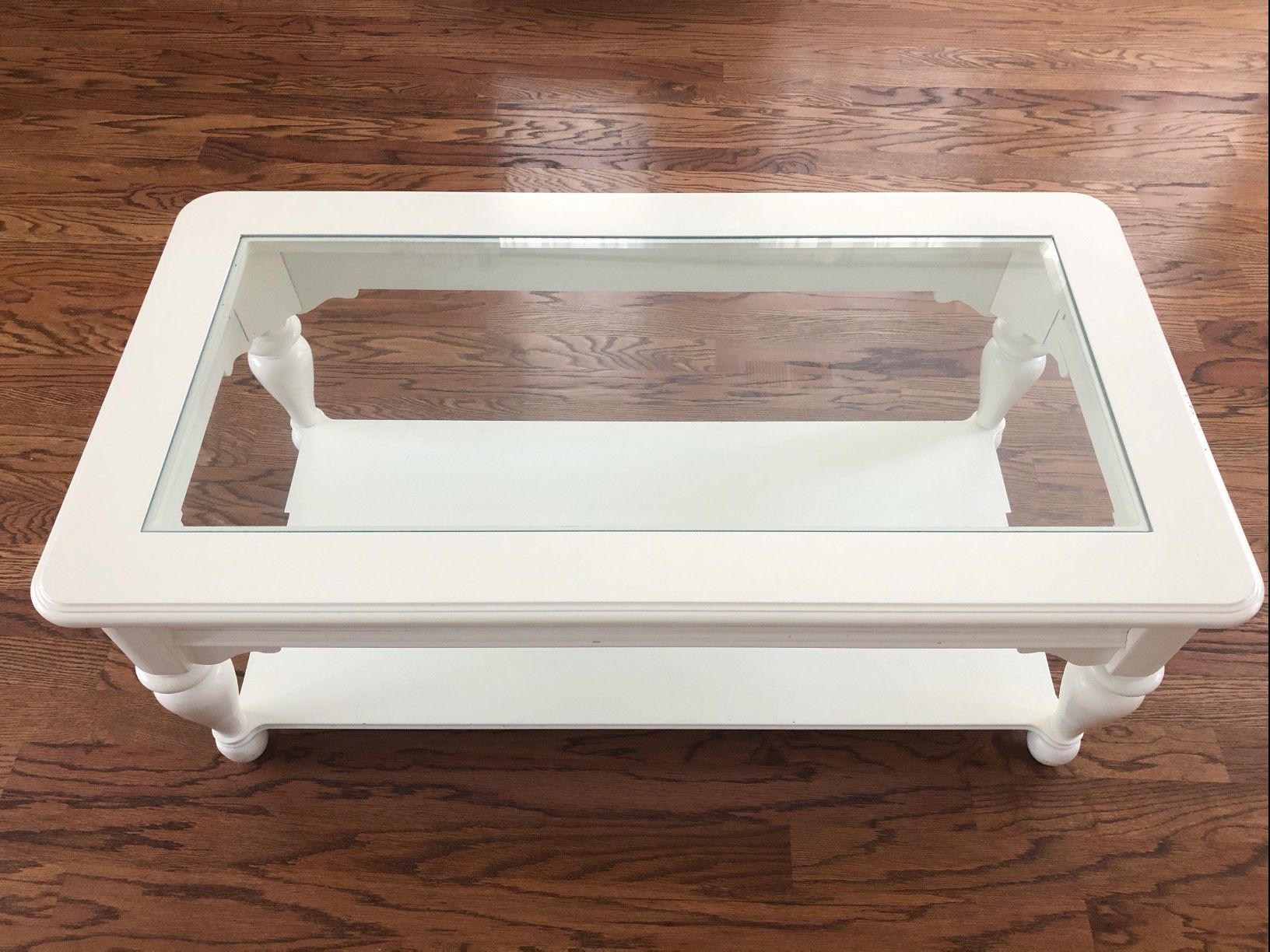 White wooden coffee table glass top