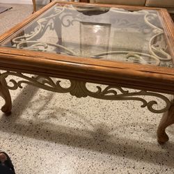1 glass top coffee table and 1 end tables. 
