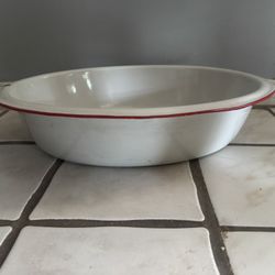 vintage white enamelware wash basin With red rim