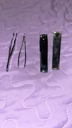 TWEEZERS OR NAIL CLIPPERS