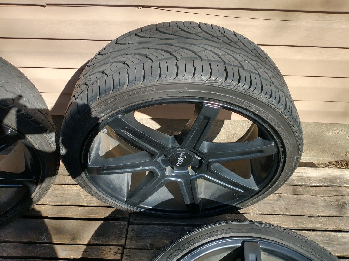 American Racing 22 Inch by 11.5 Wide All Black 7 Bars with Like New Tires With Really Good Tread