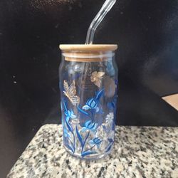Glass cup with blue butterfly design
