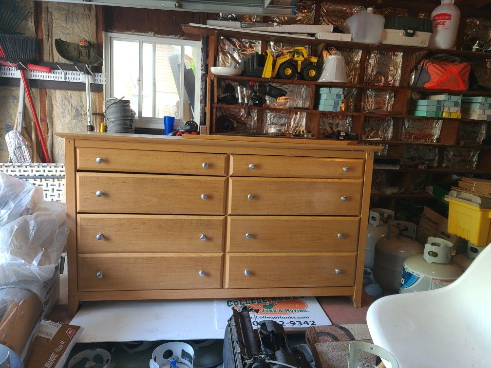 A 6 drawer dresser with mirror.