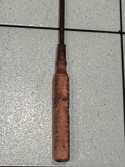 An exceptionally long 39-inch Buffalo wooden-handle screwdriver is a rare and highly unique find for tool collectors. Because standard long cabinet sc