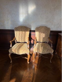 Two walnut wood and upholstered head dining chairs