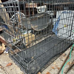 XL animal crate. Double latching doors. Front and rear. black metal finish. 20.5"x45"x30"
