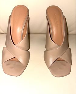 Elegant high-heeled mule from the American fashion brand Halston Heritage. Backless mule silhouette with wide crisscrossing straps. Heel: High and sty