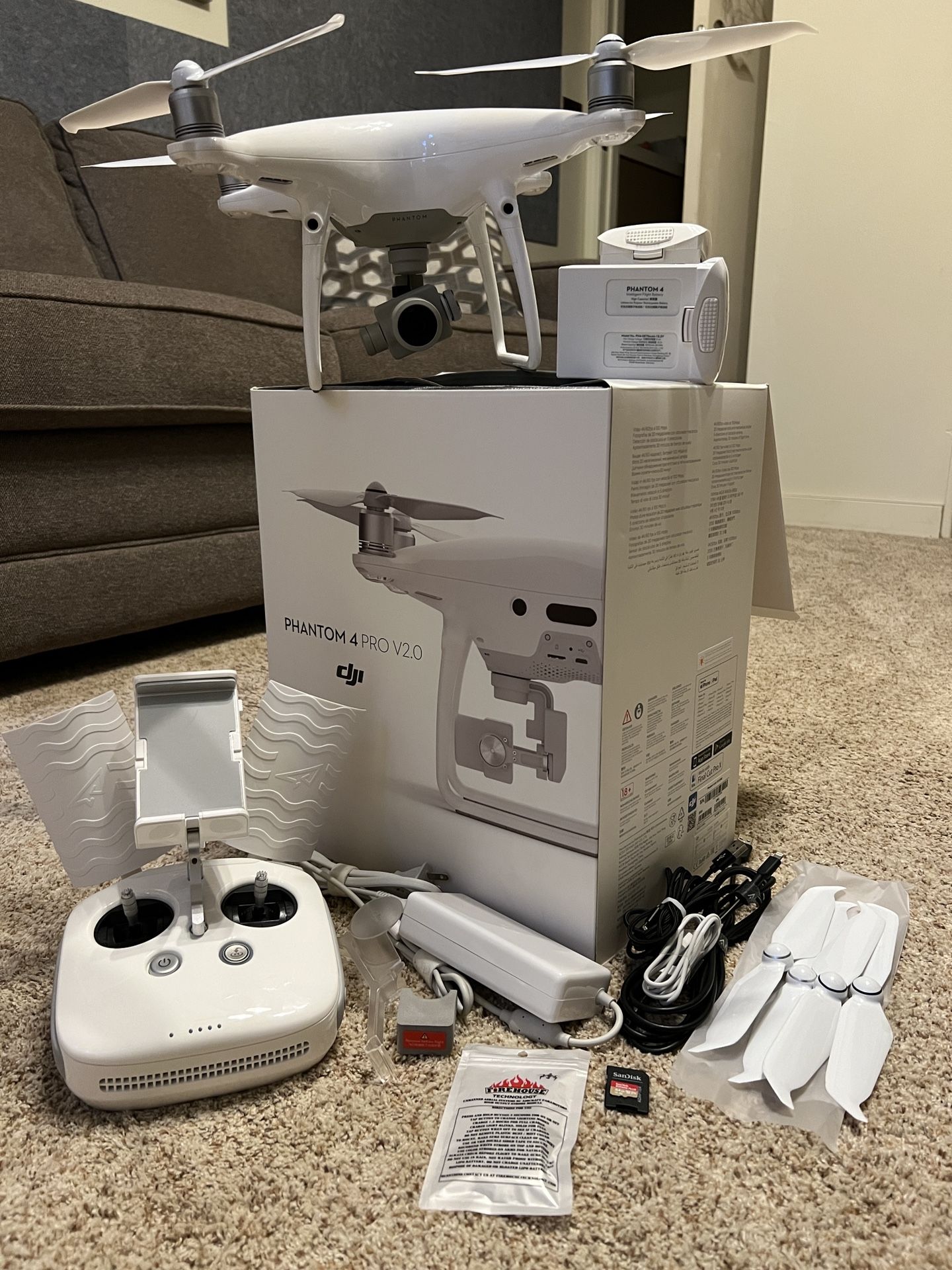 Phantom 4 Pro V2.0 with 2 batteries, remote, original box/case, and extras.