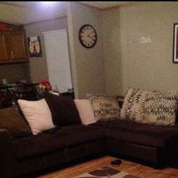 Small Brown Sectional With Pillows