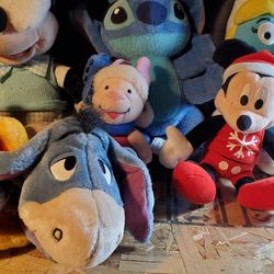 Lot of 7 disney and other plush toys