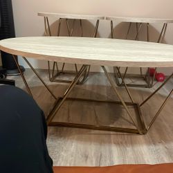 An Oval Coffee Table Beig And 2 Lamp Tables