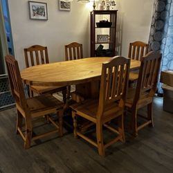 Wooden dining room table and chairs