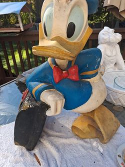 Donald Duck Vintage Figure leaning against suitcase