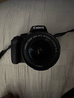 Canon EOS Rebel T7 DSLR camera with the 18-55mm IS II zoom kit lens.