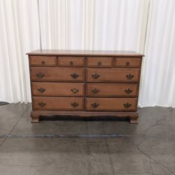 Traditional Brown Wood Ten-Drawer Dresser with Bracket Feet