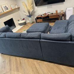 Going fast….Ashley Furniture Navy Blue Sectional + Ottoman – Great Condition