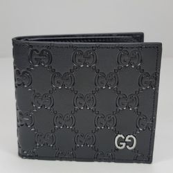 GUCCI SIGNATURE LOGO BI-FOLD WALLET.