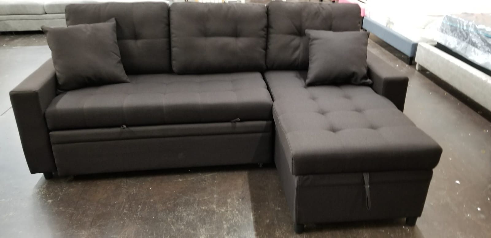 Dark grey sofa with pullout bed