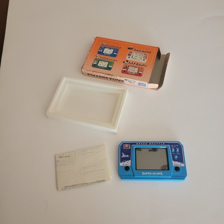 Vintage 1992 handheld game " Space shuttle". New, with manual.
Collectable Item.
Made in Japan. By Matsushima Kogyo. Model MG391A. Extremely Rare!
We