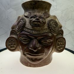Moche pottery portrait vessel from ancient Peru. Produced by the Moche civilization between 100 BCE and 800 CE. These vessels are highly realistic por