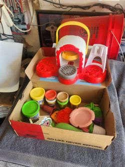 Multiple pieces of play dough assorted items