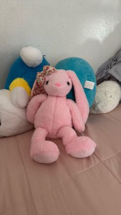 Pink bunny with a flower bow Pink bunny with a flower bow