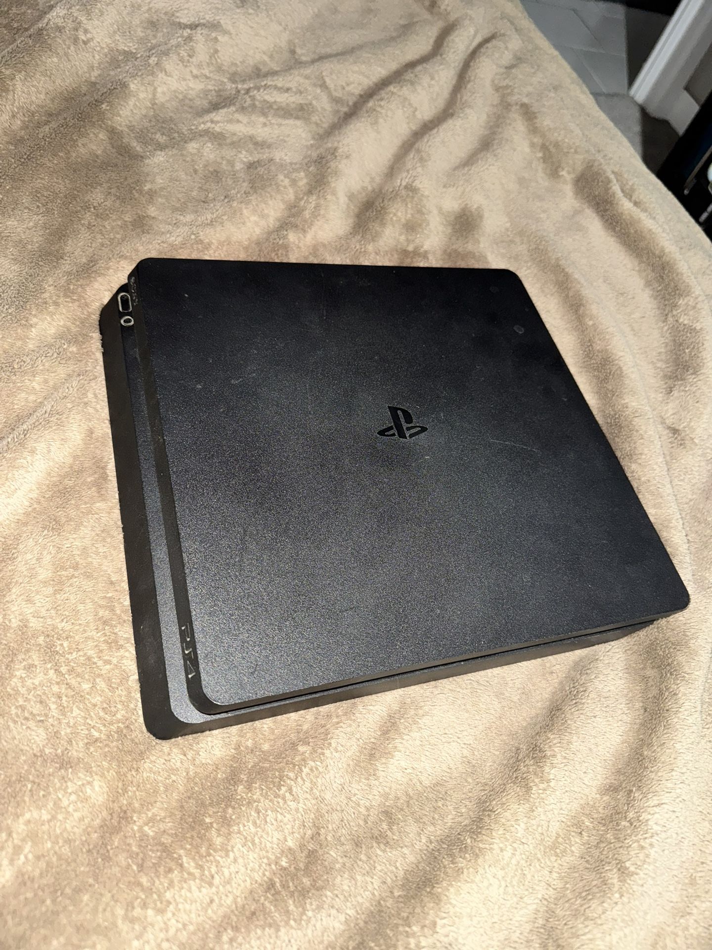 PS4 Slim (No controller) + 2 Games