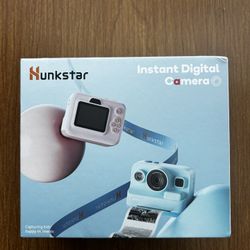I'm selling a pink instant camera for kids.