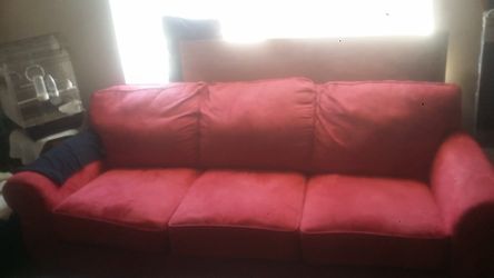 Red sleeping sofa just needs a little bit of cleaning don't have room for it anymore
