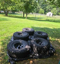5 Yokohama Geolander M/T  and 5 Black Rock rims