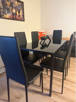Glass table with 6 chairs