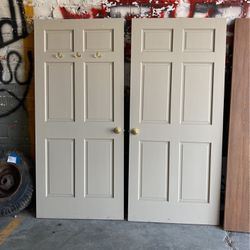 2 Solid 6 Panel Doors With Brass Fixtures  