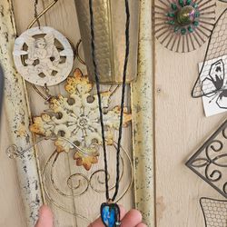 Zuni leather necklace with blue pendant.