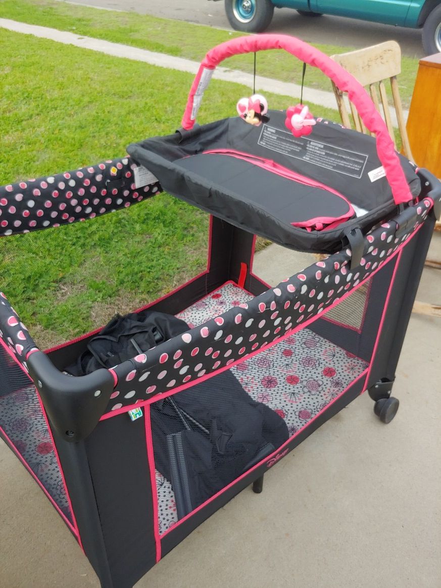 Baby Minnie Mouse playpen with changing table and infant bed accessory for Sale in Fresno, CA