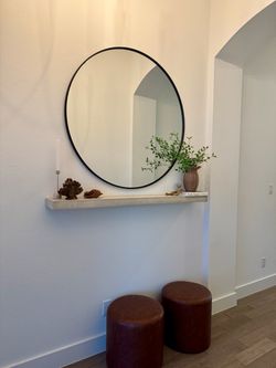 Round metal black wall mirror