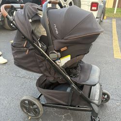 Nuna TAVO Next stroller, displayed as part of a travel system with a Nuna PIPA series infant car seat attached. 