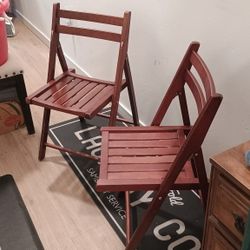 2 wood folding chairs