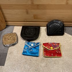 Vintage leather wallets made a black leather, two little material, coin, purses, and a gold glitter mirror. Perfect condition.