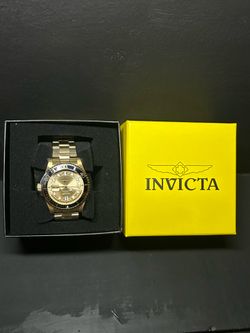 Gold Invicta watch